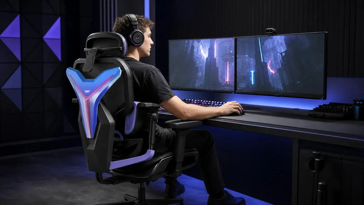 Gamer using a black ergonomic gaming chair with blue and purple RGB accents at a dual-monitor esports desk