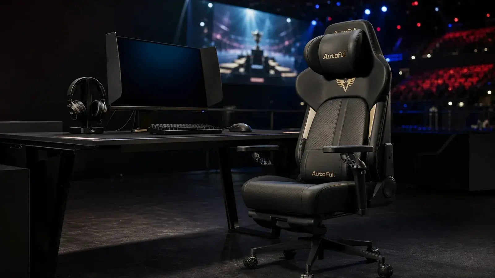 An empty black ergonomic gaming chair and gaming station on an esports stage