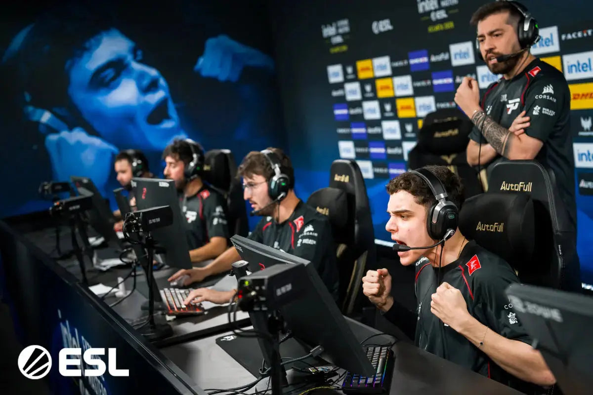 Esports players competing at gaming stations with ergonomic chairs and headsets