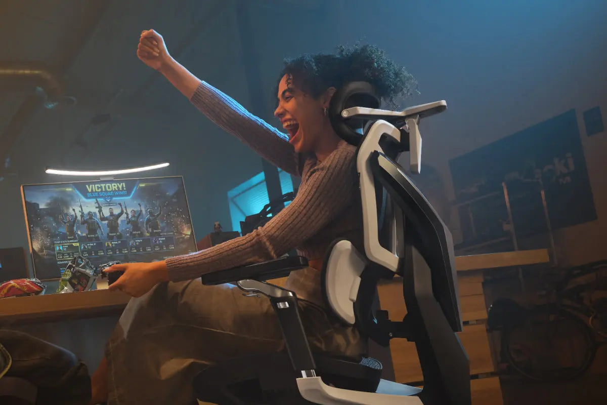 Gamer stretching in an ergonomic gaming chair after winning a match