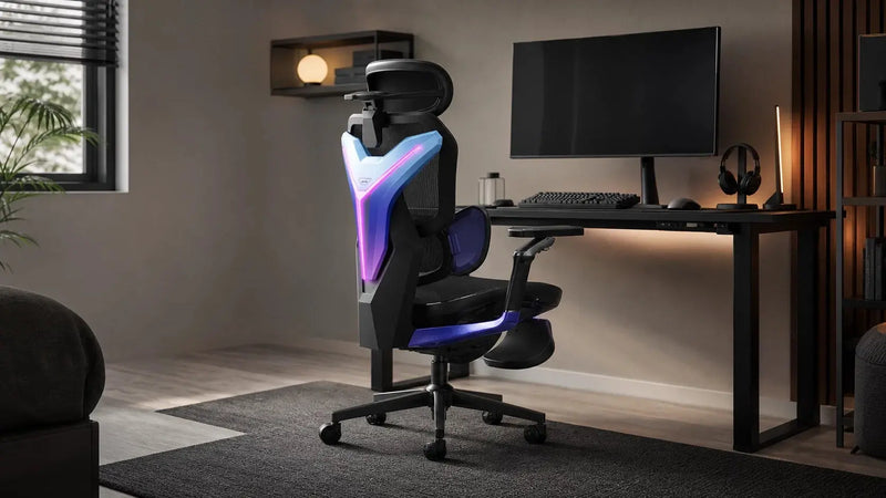 A black and blue gaming chair beside a gaming desk with a monitor, keyboard, and headset in a softly lit home gaming room